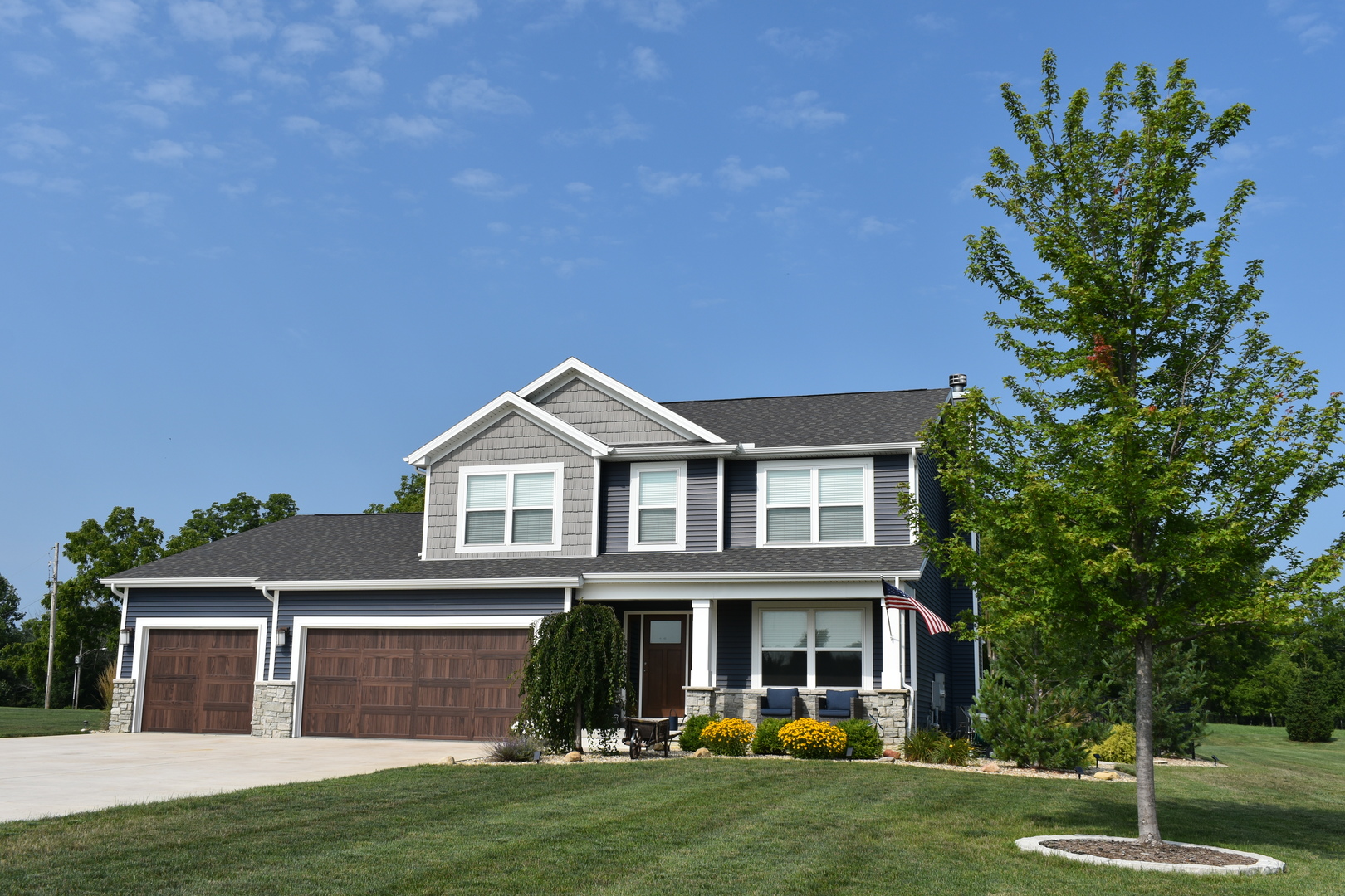 13 Wolf Run Road El Paso, IL 61738 - Photo 2 of 57 a front view of a house with garden
