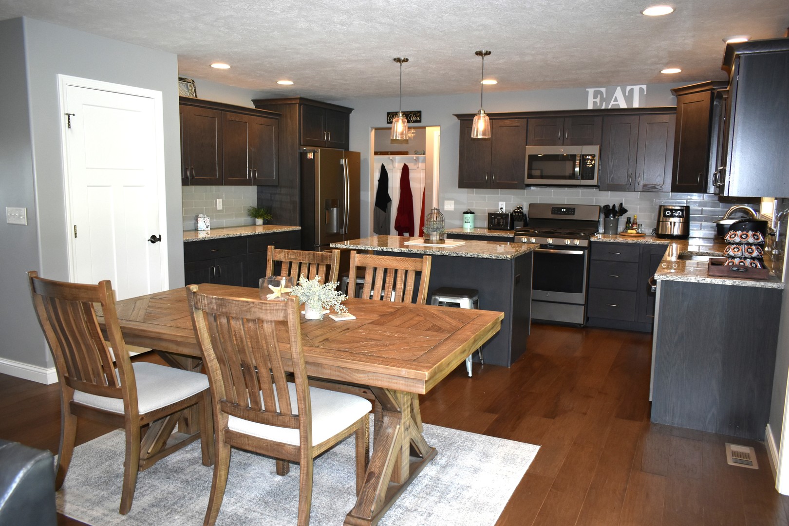 13 Wolf Run Road El Paso, IL 61738 - Photo 21 of 57 a kitchen with stainless steel appliances granite countertop a refrigerator a stove top oven a sink dishwasher and wooden cabinets
