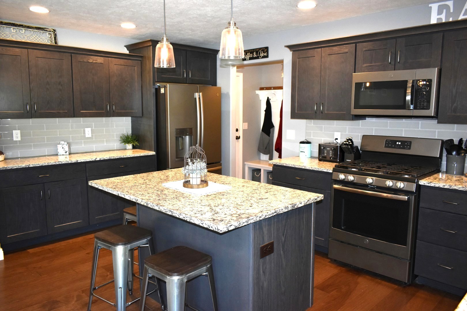 13 Wolf Run Road El Paso, IL 61738 - Photo 23 of 57 a kitchen with stainless steel appliances granite countertop a sink stove and refrigerator