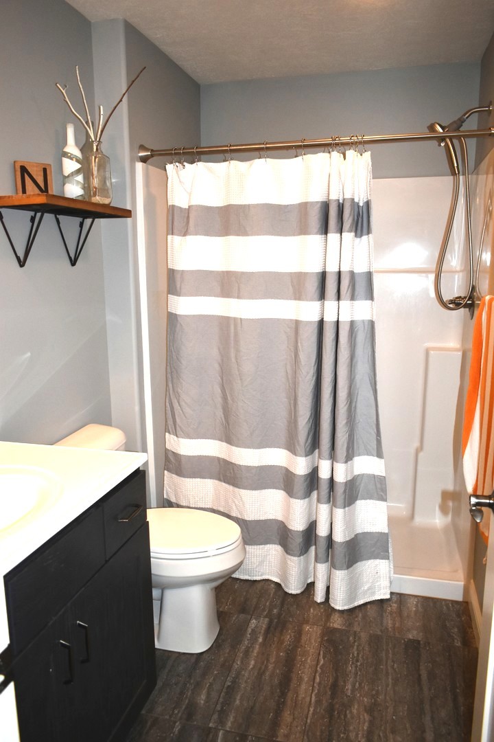 13 Wolf Run Road El Paso, IL 61738 - Photo 30 of 57 a bathroom with a sink toilet and shower