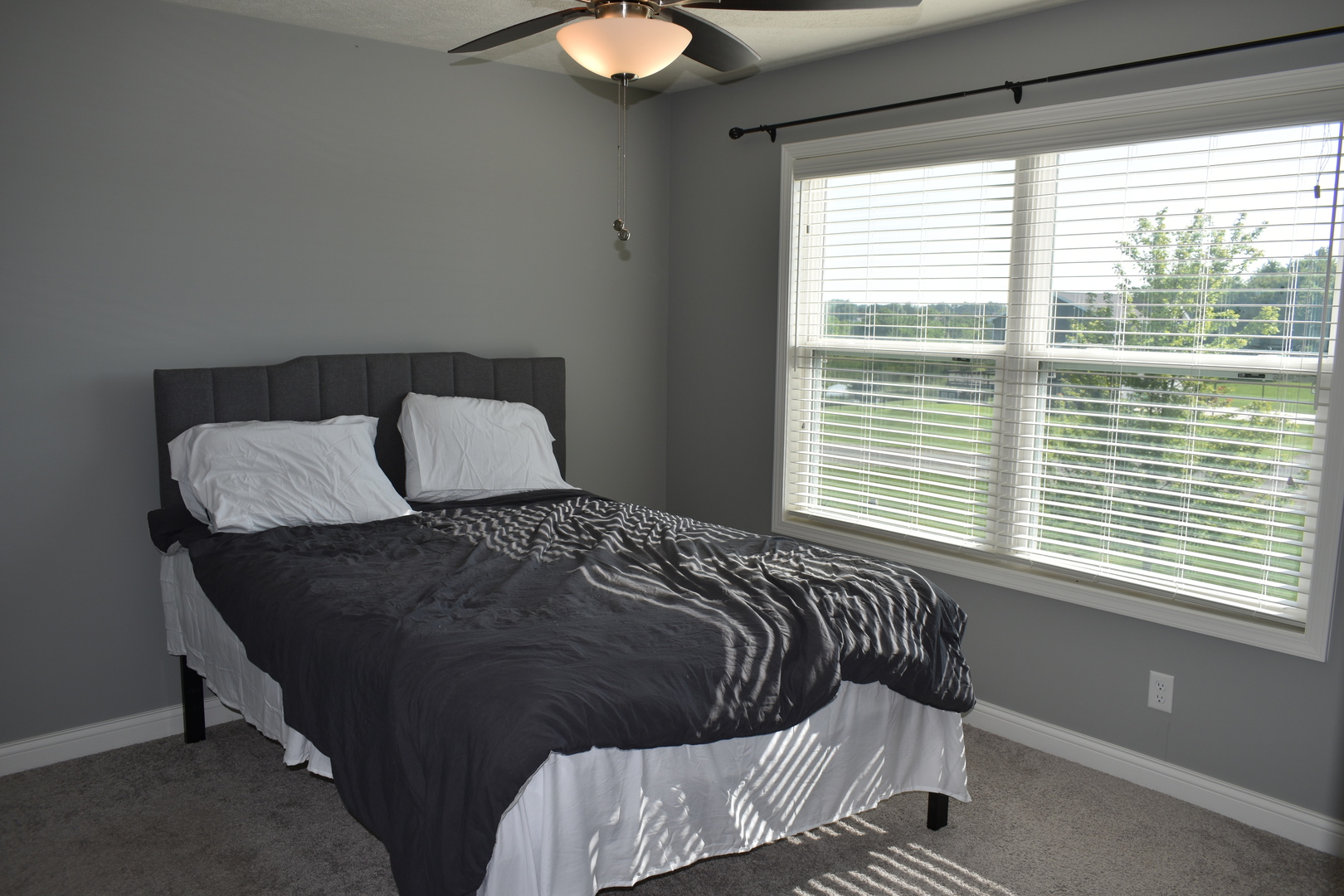 13 Wolf Run Road El Paso, IL 61738 - Photo 39 of 57 a bed sitting in a bedroom next to a window