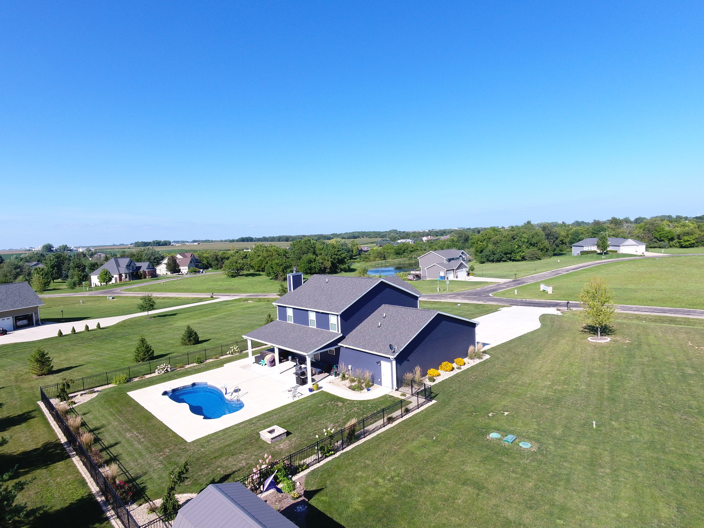 13 Wolf Run Road El Paso, IL 61738 - Photo 57 of 57 an aerial view of a house with garden space and outdoor seating