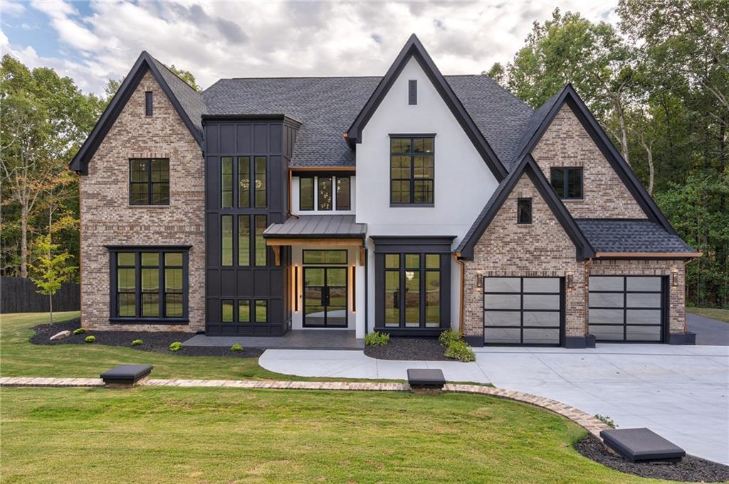 a view of a house with swimming pool and porch
