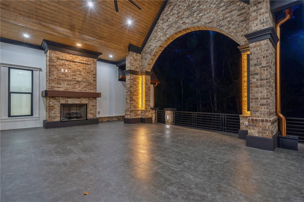 4459 Grady Smith Road Loganville, GA 30052 - Photo 109 of 124 a view of an empty room with fireplace and a window