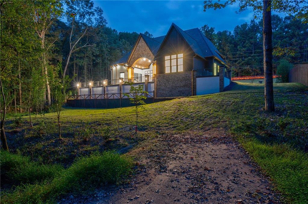 4459 Grady Smith Road Loganville, GA 30052 - Photo 116 of 124 a front view of a house with yard and green space