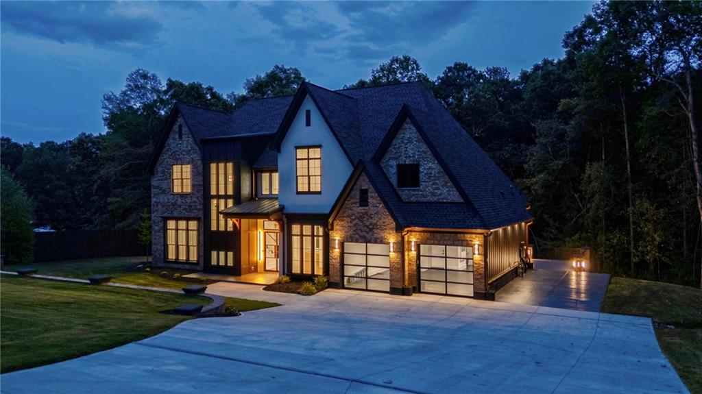 4459 Grady Smith Road Loganville, GA 30052 - Photo 118 of 124 a front view of a house with a yard