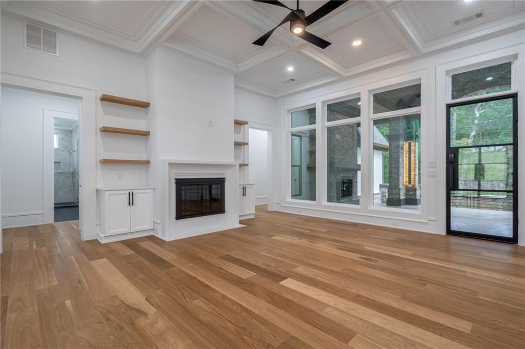 4459 Grady Smith Road Loganville, GA 30052 - Photo 23 of 124 a view of an empty room with a fireplace and a window