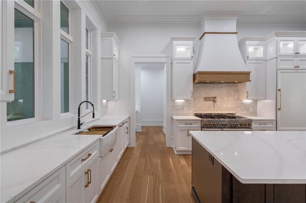 4459 Grady Smith Road Loganville, GA 30052 - Photo 26 of 124 a kitchen with stainless steel appliances granite countertop a sink stove and refrigerator