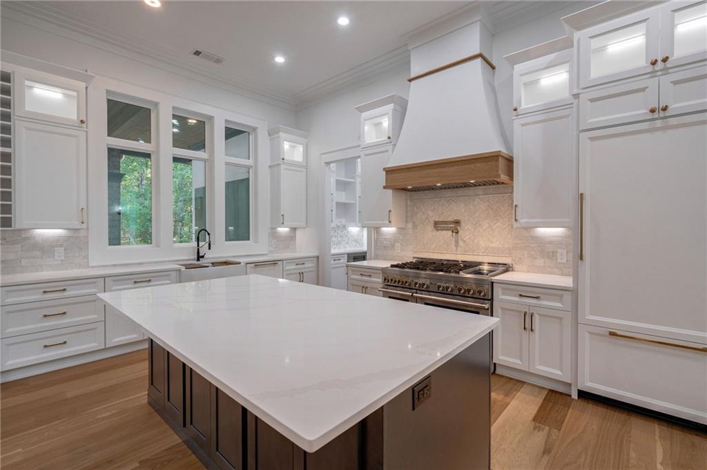 4459 Grady Smith Road Loganville, GA 30052 - Photo 28 of 124 a kitchen with a stove a sink and a refrigerator