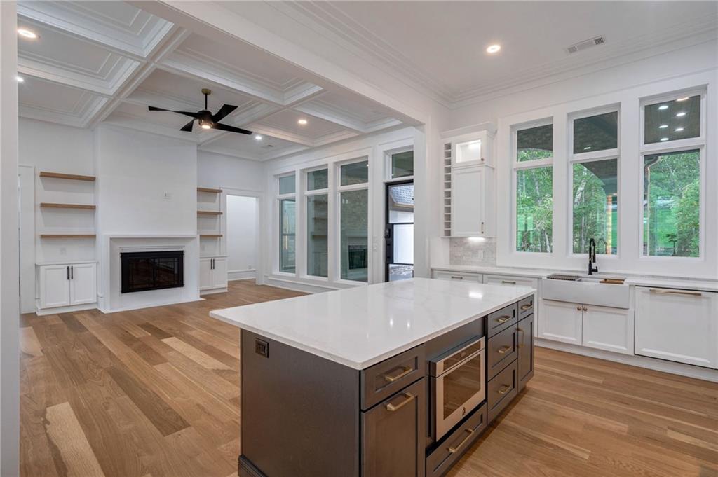 4459 Grady Smith Road Loganville, GA 30052 - Photo 30 of 124 a kitchen that has a sink and a stove in it