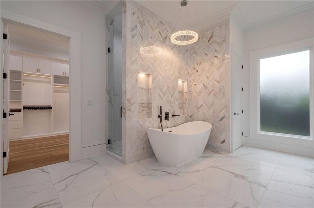 4459 Grady Smith Road Loganville, GA 30052 - Photo 56 of 124 a spacious bathroom with a bathtub and shower