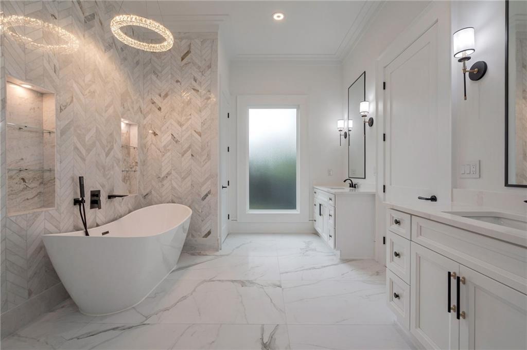 4459 Grady Smith Road Loganville, GA 30052 - Photo 57 of 124 a large spacious bathroom with a bathtub and shower