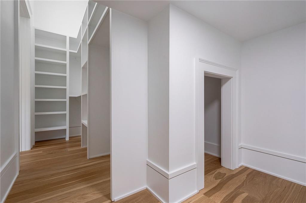 4459 Grady Smith Road Loganville, GA 30052 - Photo 78 of 124 a view of walk in closet with empty racks