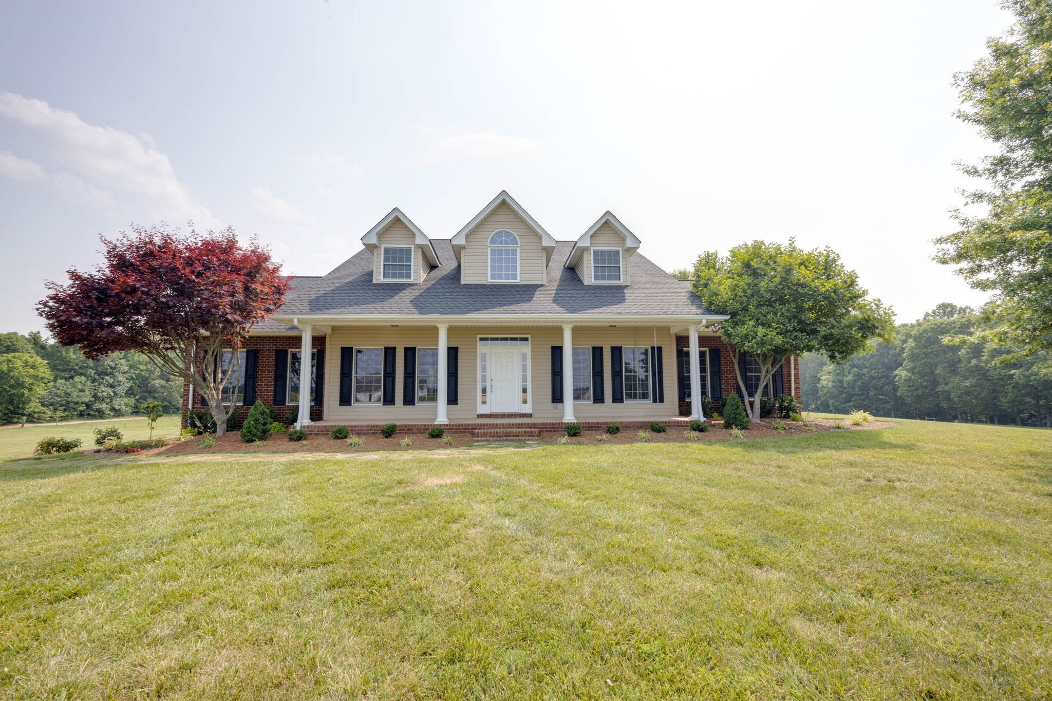 7486 Flewellyn Road Cedar Hill, TN 37032 - Photo 3 of 45 a front view of house with yard and seating area