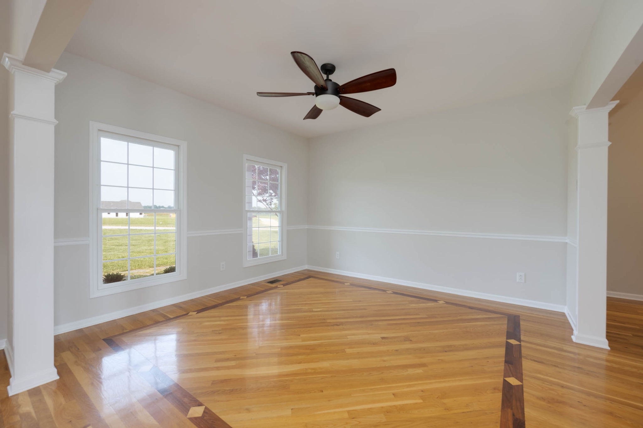 7486 Flewellyn Road Cedar Hill, TN 37032 - Photo 8 of 45 a view of empty room with wooden floor and fan
