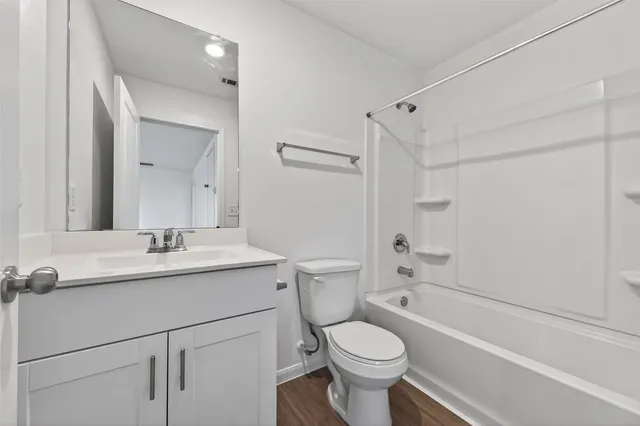 a view of an empty room with closet