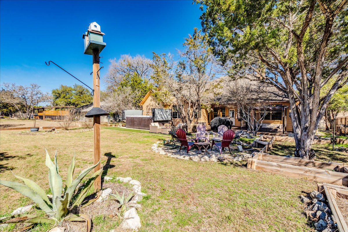 11 Rhapsody Lane Wimberley, TX 78676 - Photo 27 of 35 a view of a swimming pool with a patio