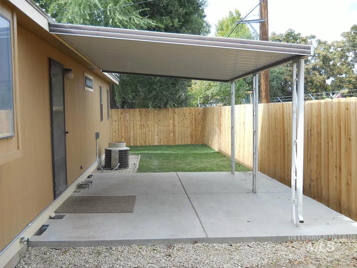 1107 East Elgin Street Caldwell, ID 83605 - Photo 3 of 5 Fenced backyard featuring a patio area