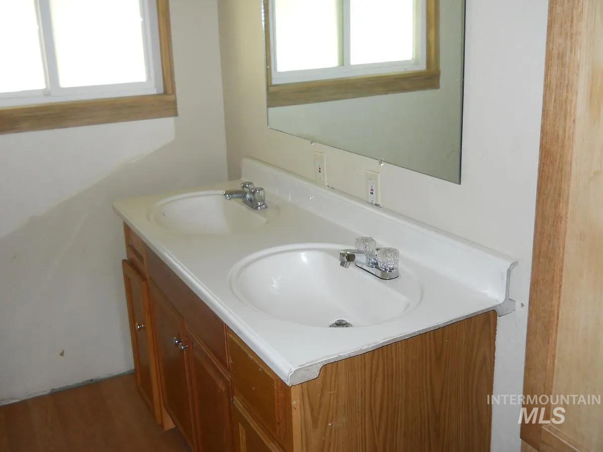 1107 East Elgin Street Caldwell, ID 83605 - Photo 4 of 5 Bathroom with double vanity and healthy amount of natural light
