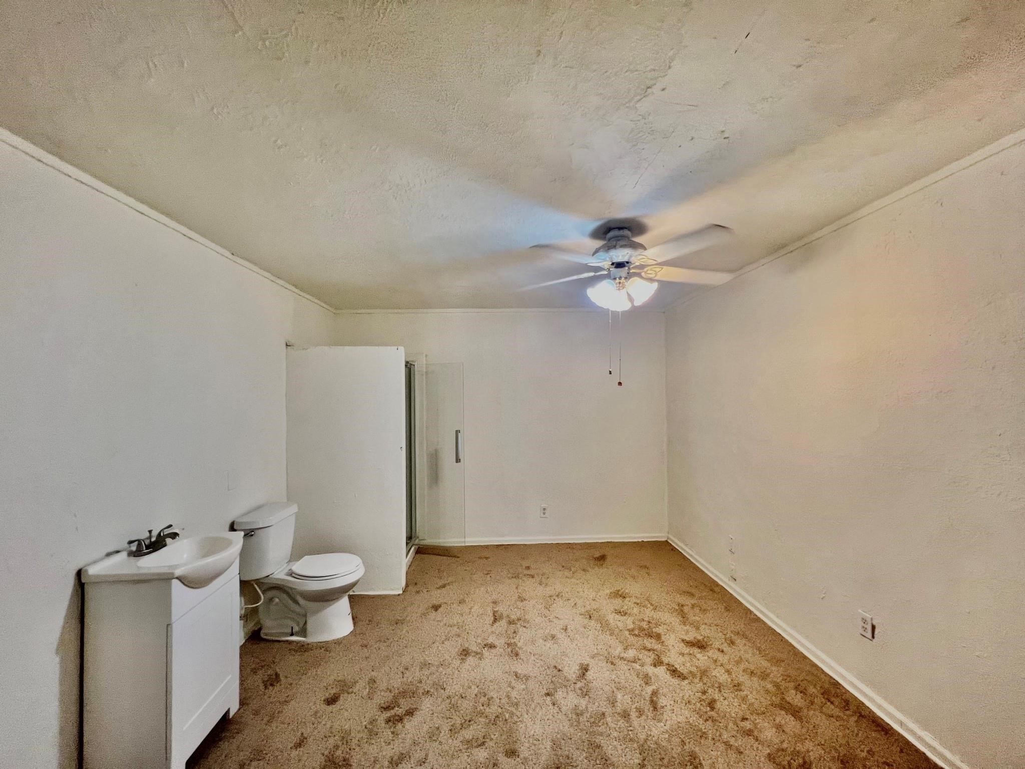 14385 Old Humble Pipeline Road Conroe, TX 77302 - Photo 9 of 10 a bathroom with a toilet