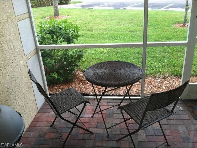 a view of a chairs and table in the outdoor space