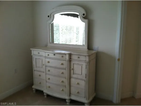 a view of a kitchen with cabinets