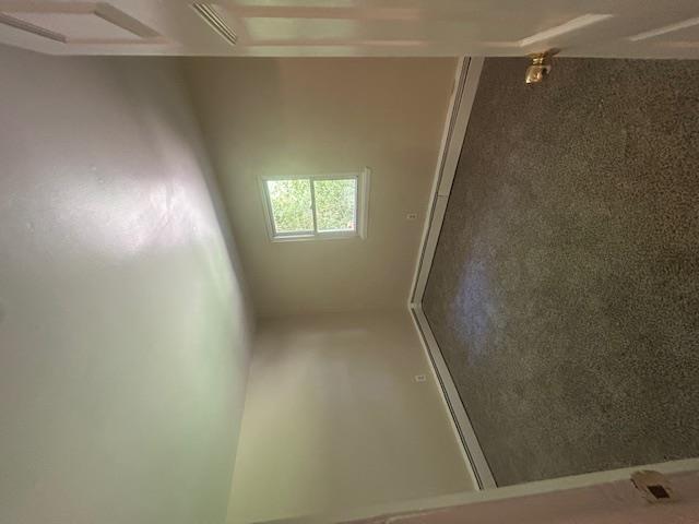 67 Johns Neck Road Shirley, NY 11967 - Photo 7 of 7 an empty room with a window