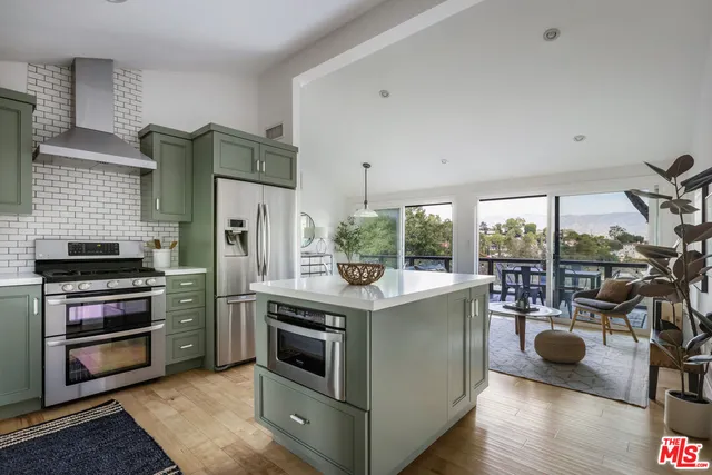 a kitchen with a stove and a refrigerator