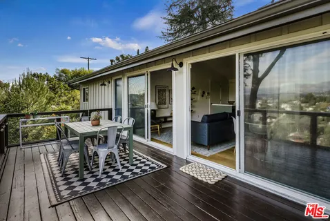 a view of balcony with furniture