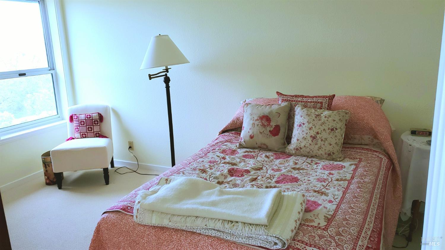 100 Thorndale Drive, Unit 360 San Rafael, CA 94903 - Photo 5 of 8 a bed room with a bed and a chair