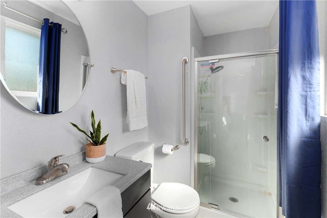 3113 Southeast 18th Street Renton, WA 98058 - Photo 14 of 30 a bathroom with a sink a toilet and shower