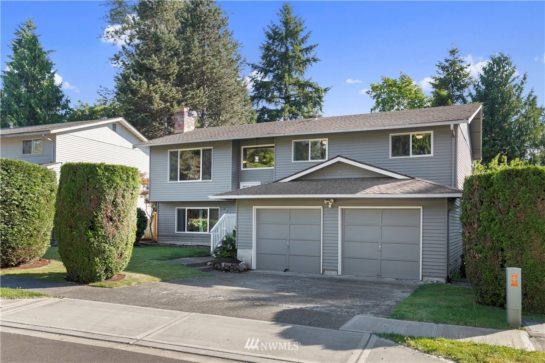 3113 Southeast 18th Street Renton, WA 98058 - Photo 29 of 30 a front view of a house with a garden
