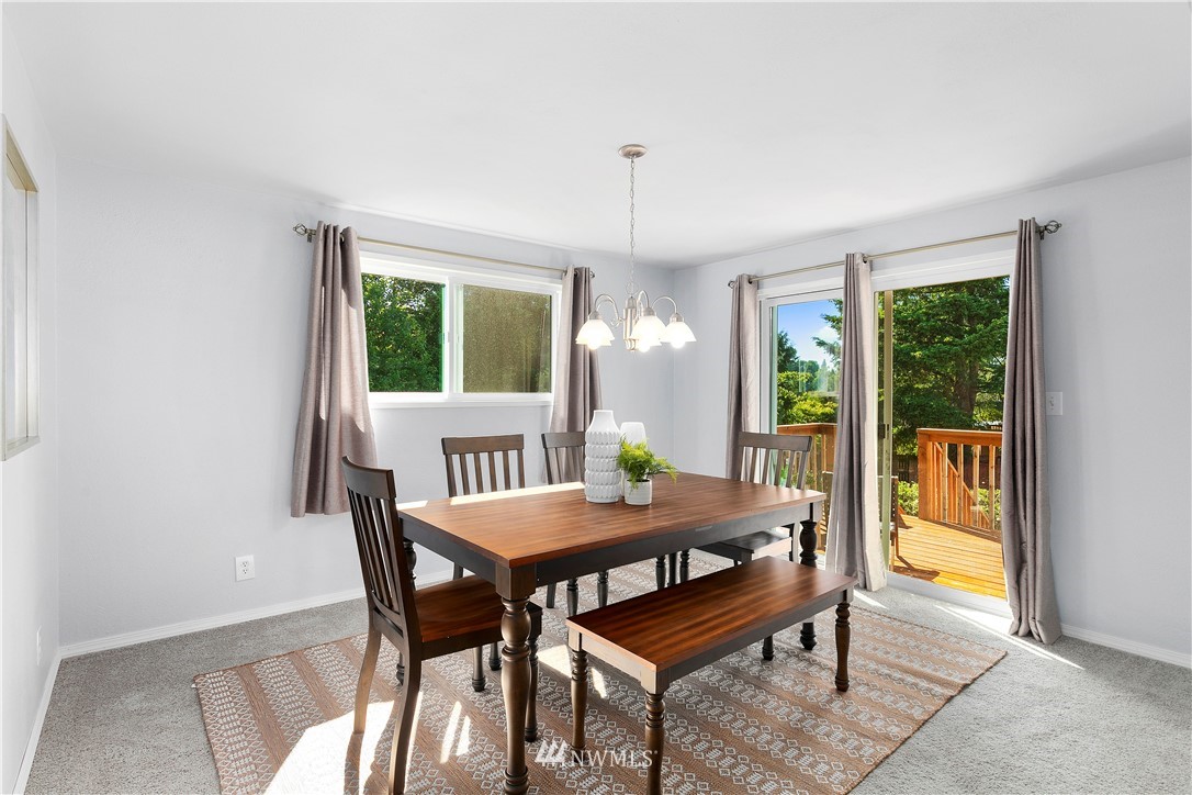 3113 Southeast 18th Street Renton, WA 98058 - Photo 7 of 30 a view of a dining room with furniture window and outside view