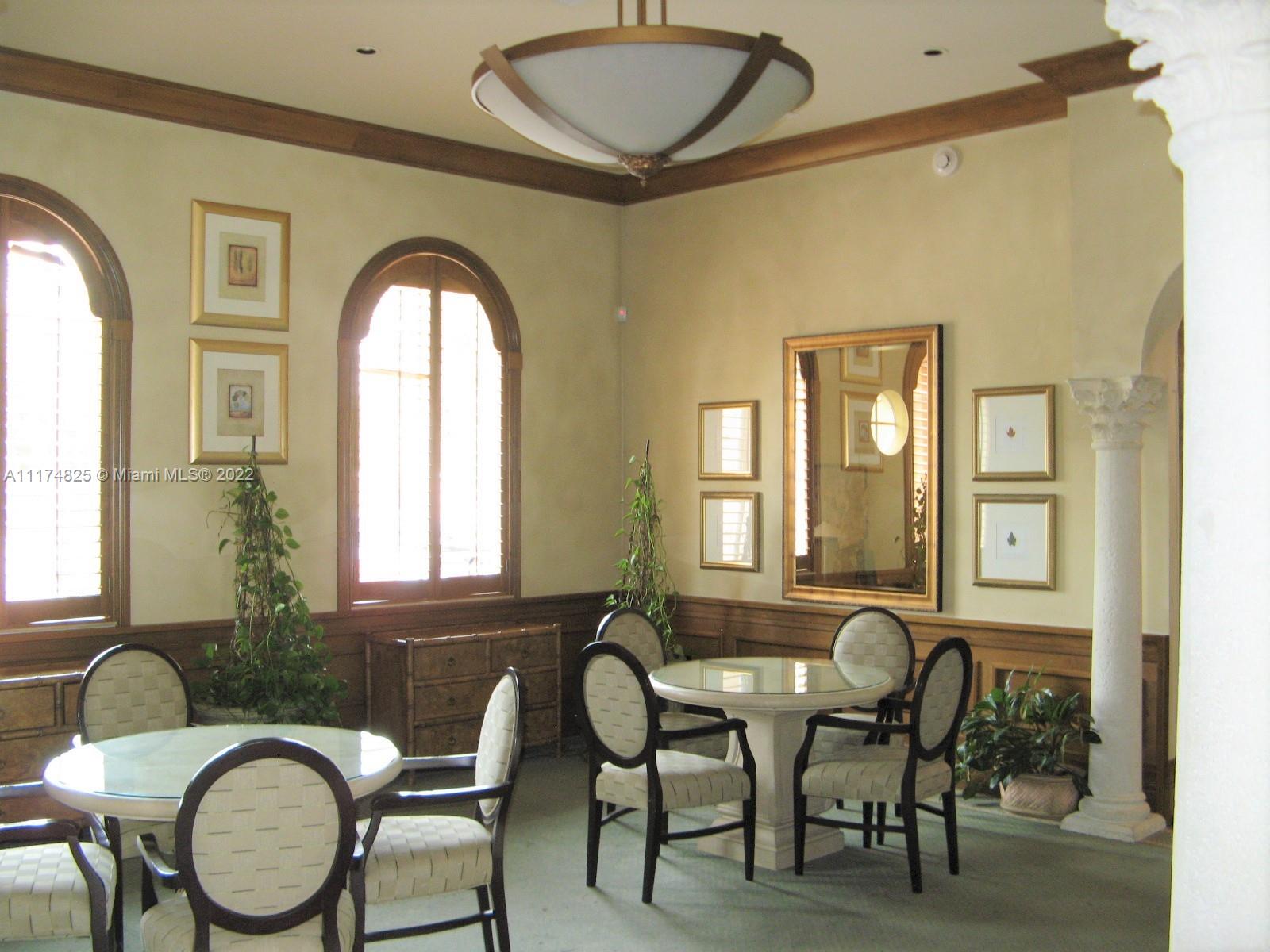 4402 Southwest 160th Avenue, Unit 925 Miramar, FL 33027 - Photo 20 of 34 a front view of a house with wooden floor and furniture