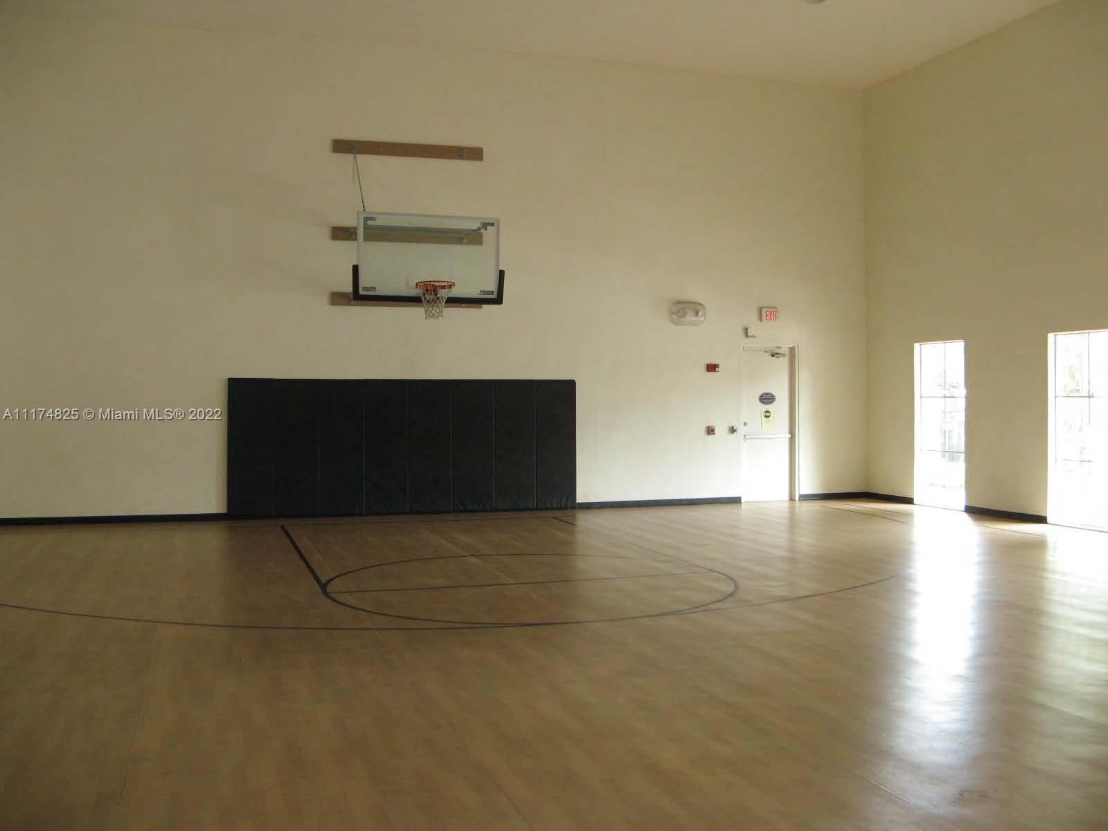 4402 Southwest 160th Avenue, Unit 925 Miramar, FL 33027 - Photo 21 of 34 an empty room with windows and fireplace