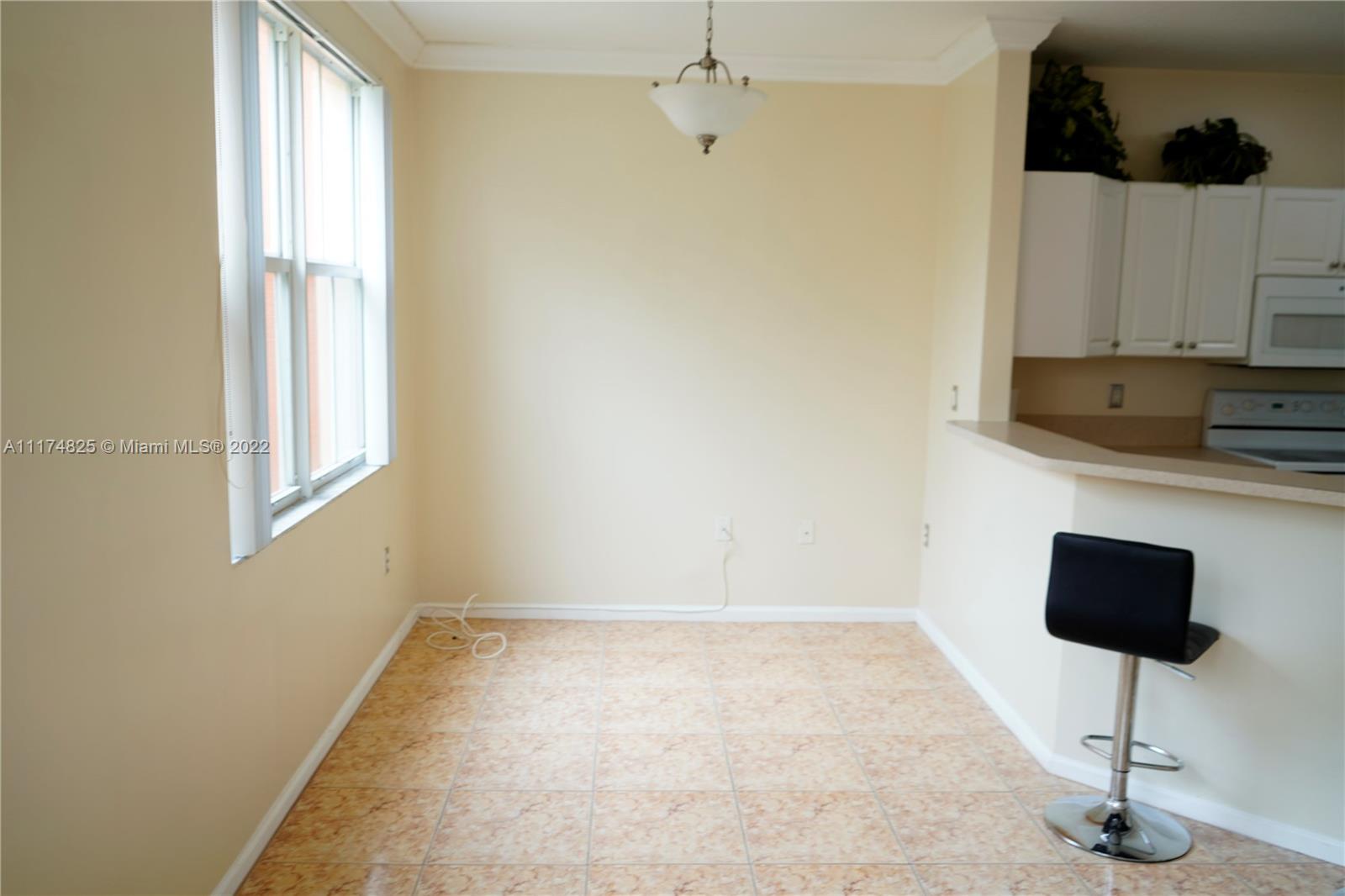 4402 Southwest 160th Avenue, Unit 925 Miramar, FL 33027 - Photo 9 of 34 a view of kitchen and wooden floor
