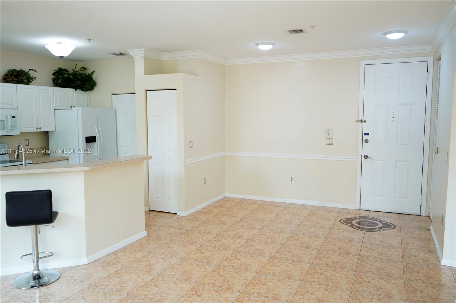 4402 Southwest 160th Avenue, Unit 925 Miramar, FL 33027 - Photo 10 of 34 a view of kitchen with wooden cabinets