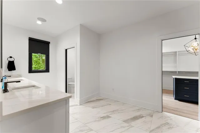 a bathroom with a double vanity sink mirror and shower