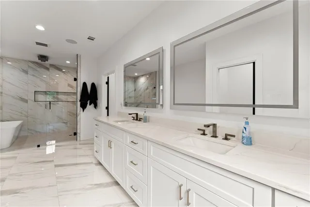 a living room with furniture or couch and a potted plant