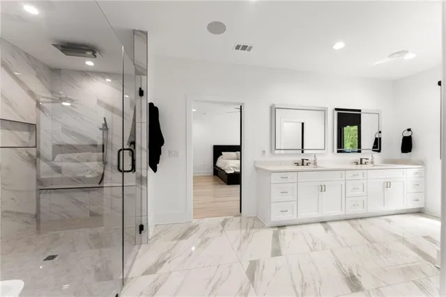 a kitchen with stainless steel appliances granite countertop a stove and a kitchen island