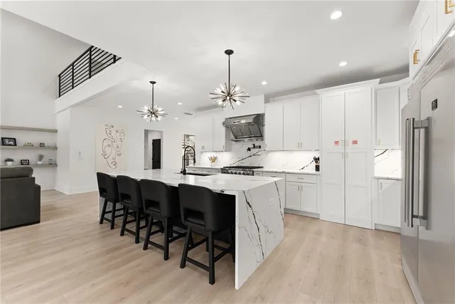 a bedroom with a bed and a ceiling fan