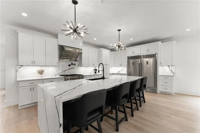 a view of a room with wooden floor and windows