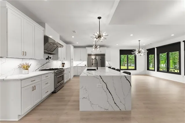 a bathroom with a double vanity sink a toilet and a mirror