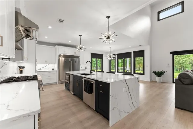 a view of an empty room with a ceiling fan