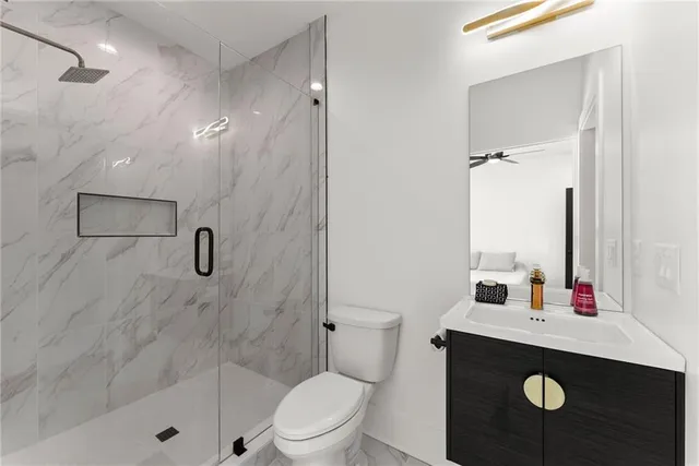 an aerial view of a houses with ocean view