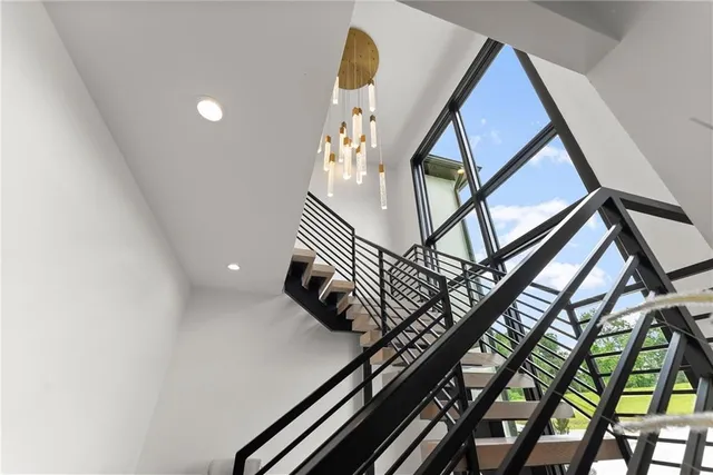 a bedroom with a bed and a ceiling fan