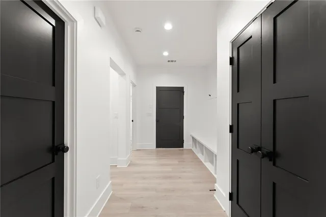 a spacious bathroom with a double vanity sink and a mirror