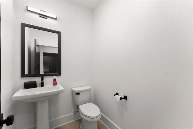 a bathroom with a double vanity sink mirror and shower