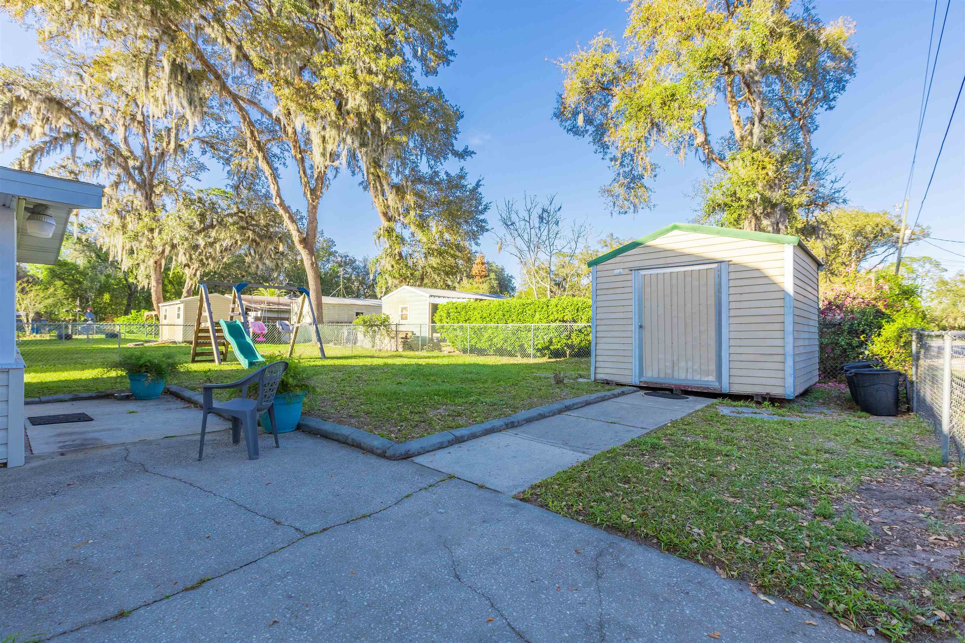 4240 New Hampshire Road Elkton, FL 32033 - Photo 11 of 35 a view of a chair and table in the garden