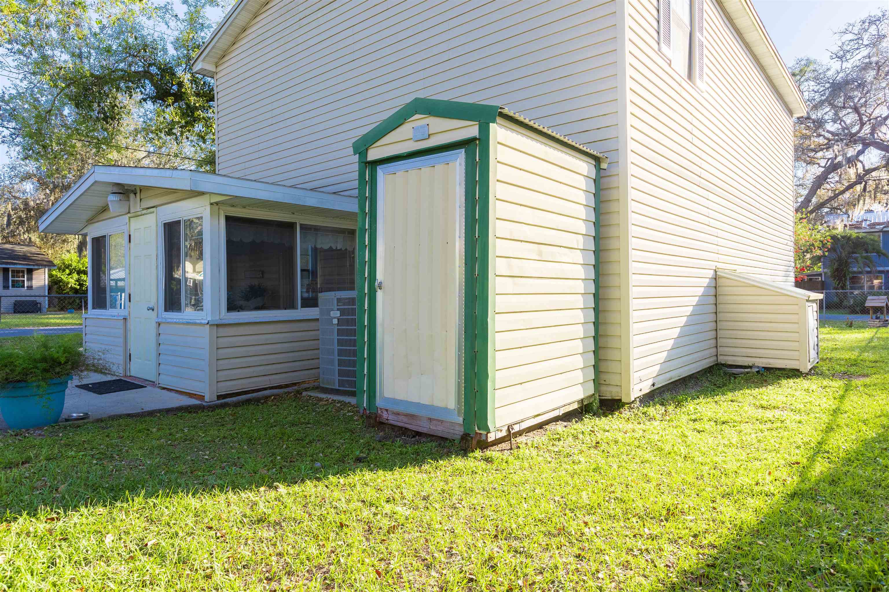 4240 New Hampshire Road Elkton, FL 32033 - Photo 12 of 35 a view of a house with a yard and garage
